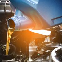 oil being poured into car change with light gradient overlay