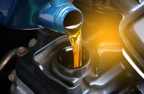Fresh oil being poured into engine